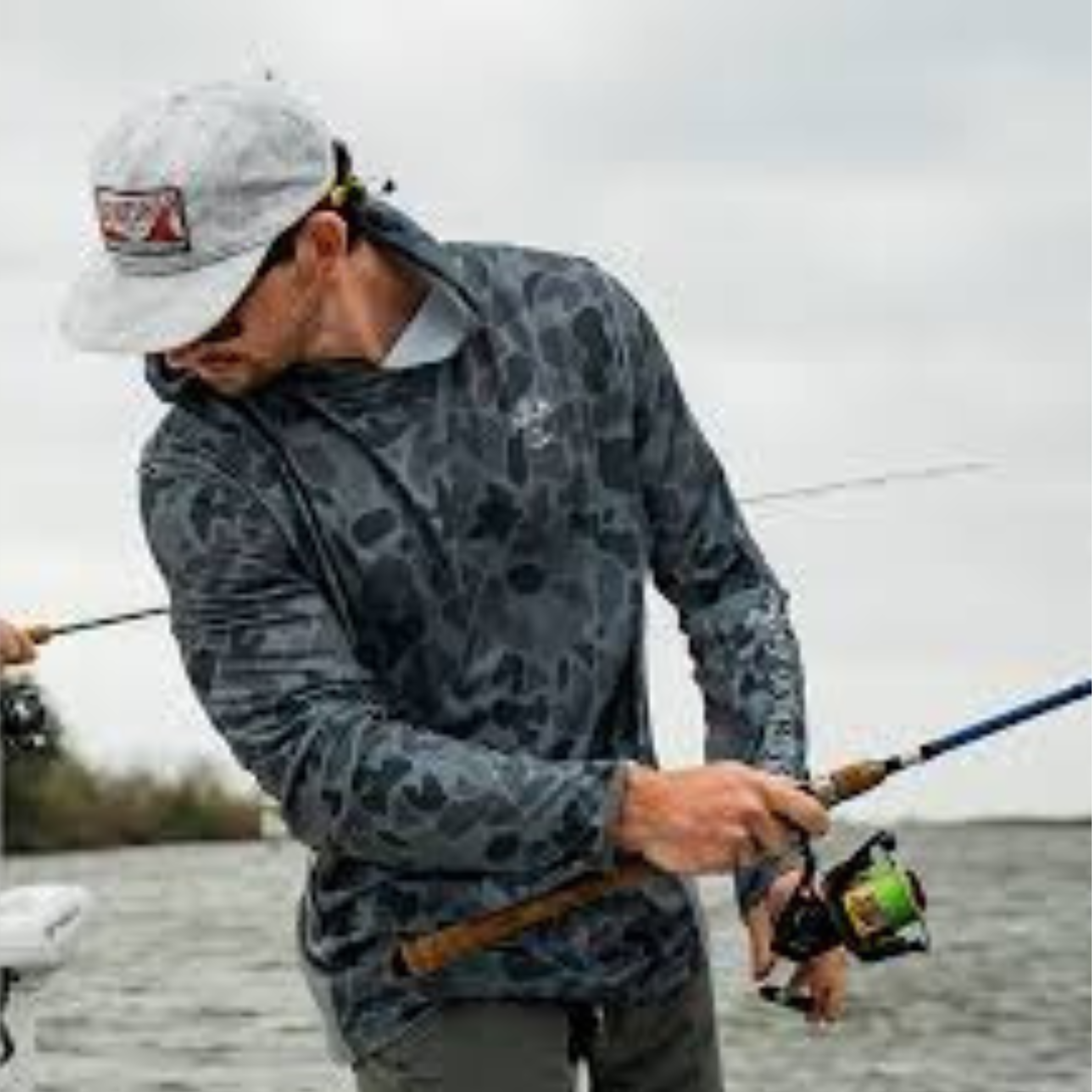 Man fishing in a Sportsman's Gear fishing hoodie from Dry Pocket