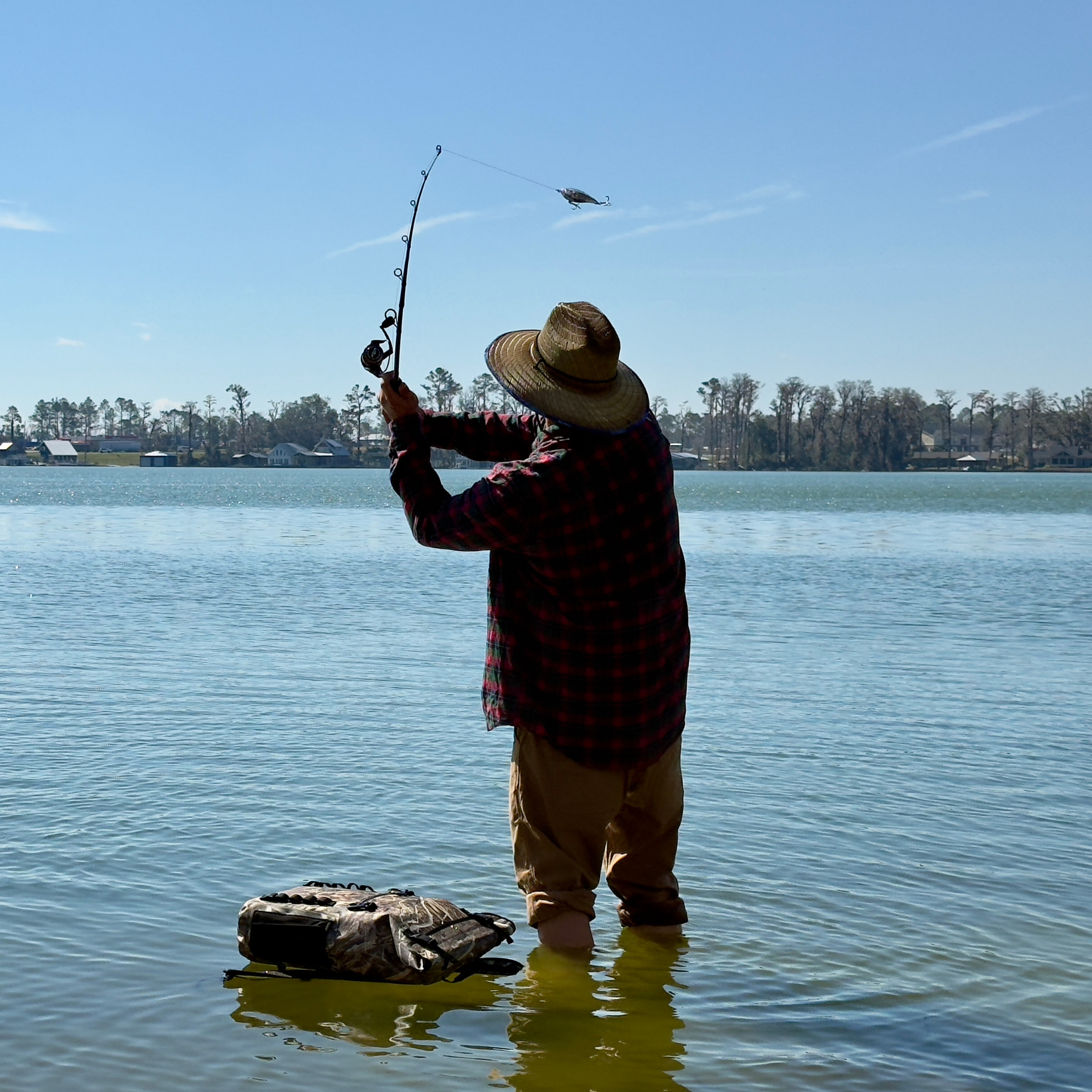 Man fishing with a Dry Pocket dry bag from Dry Pocket
