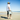 Man carrying Dry Pocket cooler on the beach