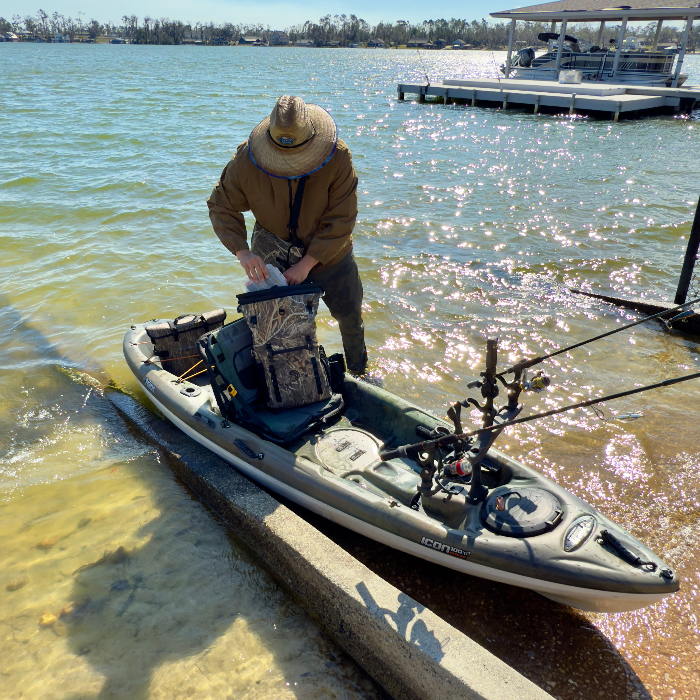 Man fishing out of kayak with a Dry Pocket Backpack Dry Bag