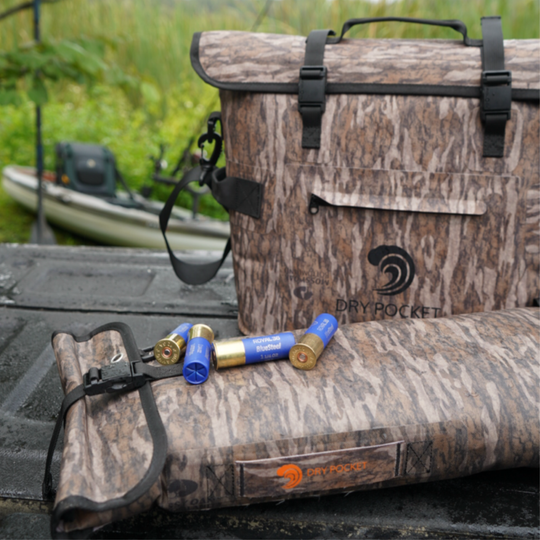 Dry Pocket's Mossy Oak Bottomland camo waterproof, scent proof, floating, and magnetic double lock, auto-sealing 10 can tote cooler or dry bag. 