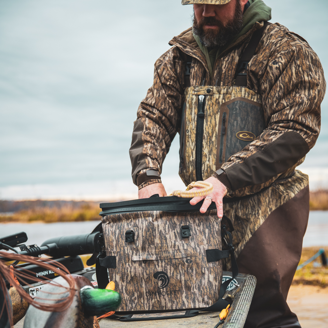 Dry Pocket's Mossy Oak Bottomland camo waterproof, scent proof, floating, and magnetic double lock, auto-sealing 10 can tote cooler or dry bag. 