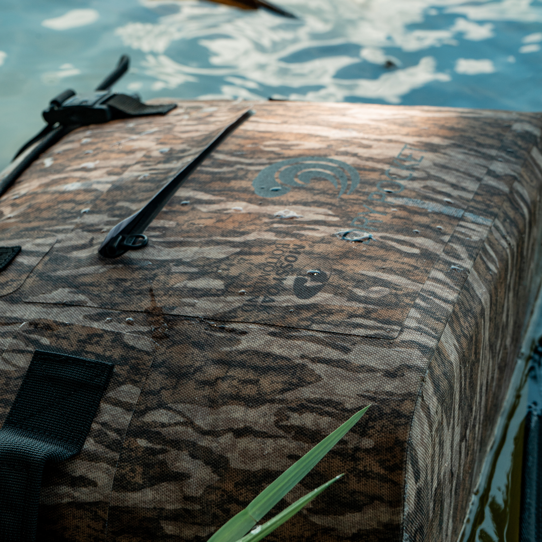 Dry Pocket's Mossy Oak Bottomland camo waterproof, scent proof, floating, and magnetic double lock, auto-sealing 10 can tote cooler or dry bag. 