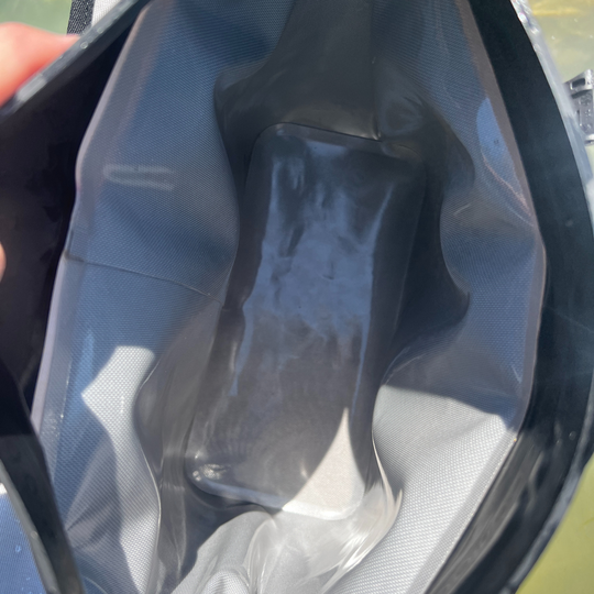Dry Pocket magnetic auto-sealing, waterproof, scent proof, and floating day pack tote cooler and dry bag combo. 