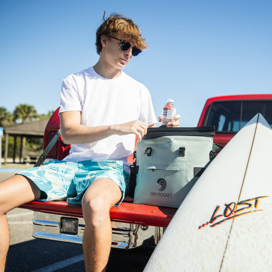 Dry Pocket desert sage magnetic auto-sealing, waterproof, scent proof, and floating 10 can tote cooler that can also act as a dry bag. 