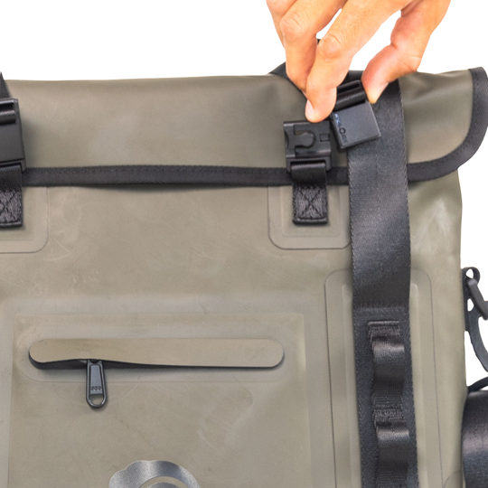 Dry Pocket hunter green magnetic auto-sealing, waterproof, scent proof, and floating 18 can tote cooler that can also act as a dry bag. 