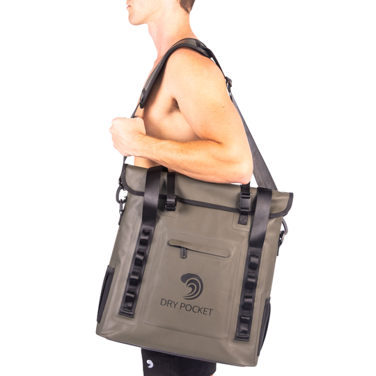 Dry Pocket hunter green magnetic auto-sealing, waterproof, scent proof, and floating 18 can tote cooler that can also act as a dry bag. 