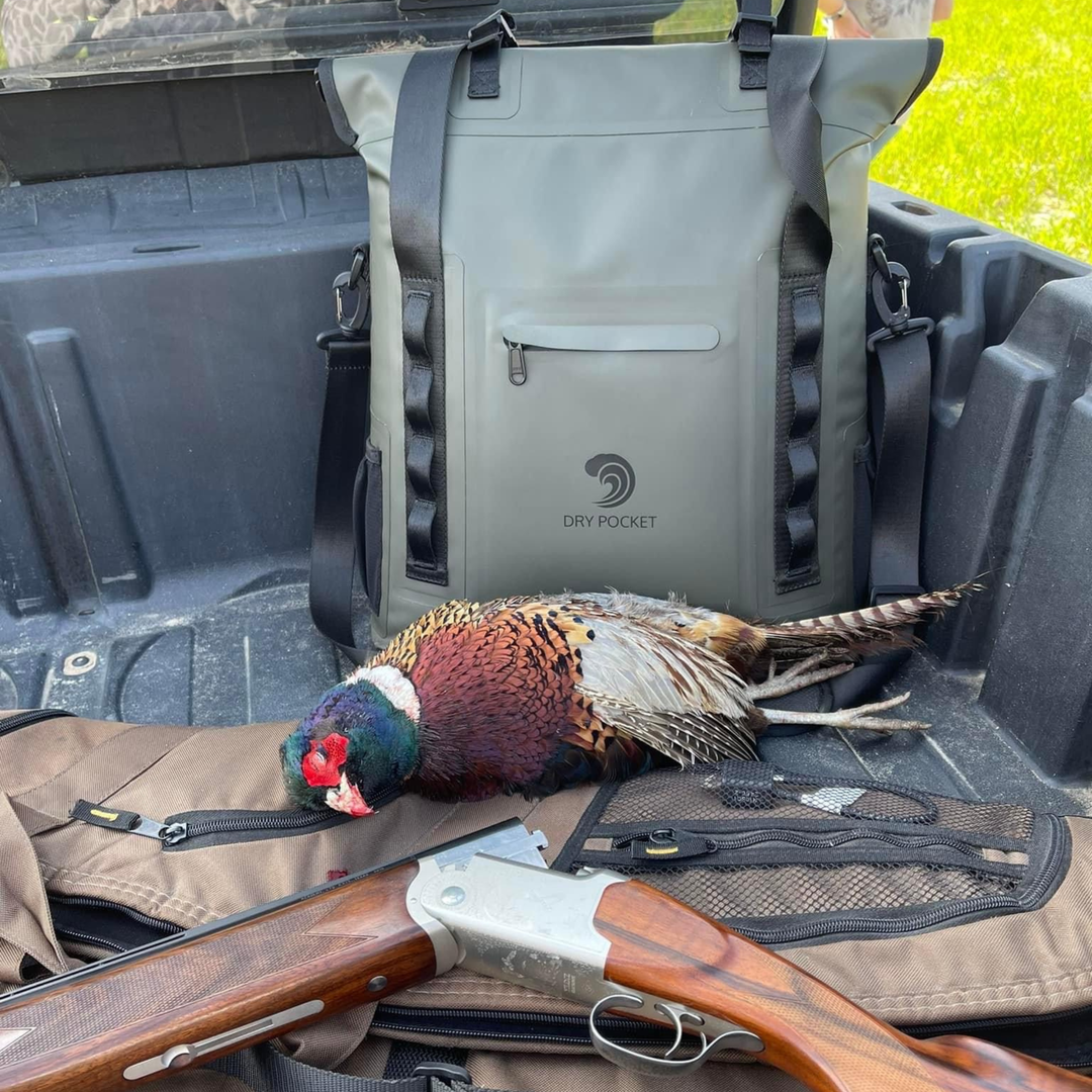 Dry Pocket hunter green magnetic auto-sealing, waterproof, scent proof, and floating 18 can tote cooler that can also act as a dry bag. 