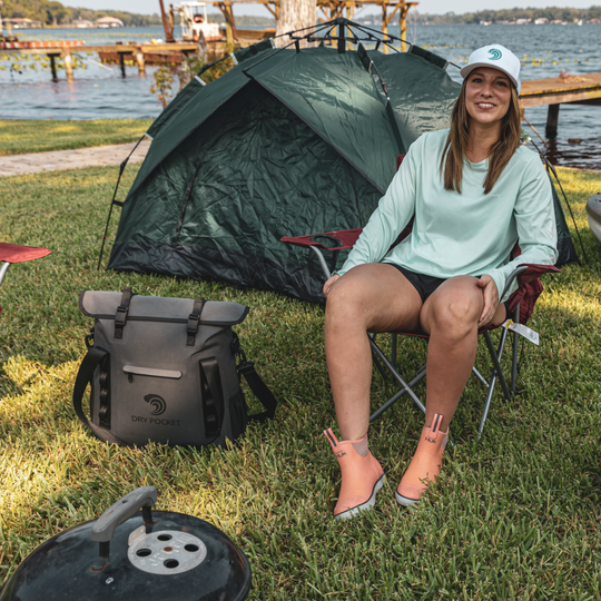 Dry Pocket grey magnetic auto-sealing, waterproof, scent proof, and floating 16 can tote cooler that can also act as a dry bag. 