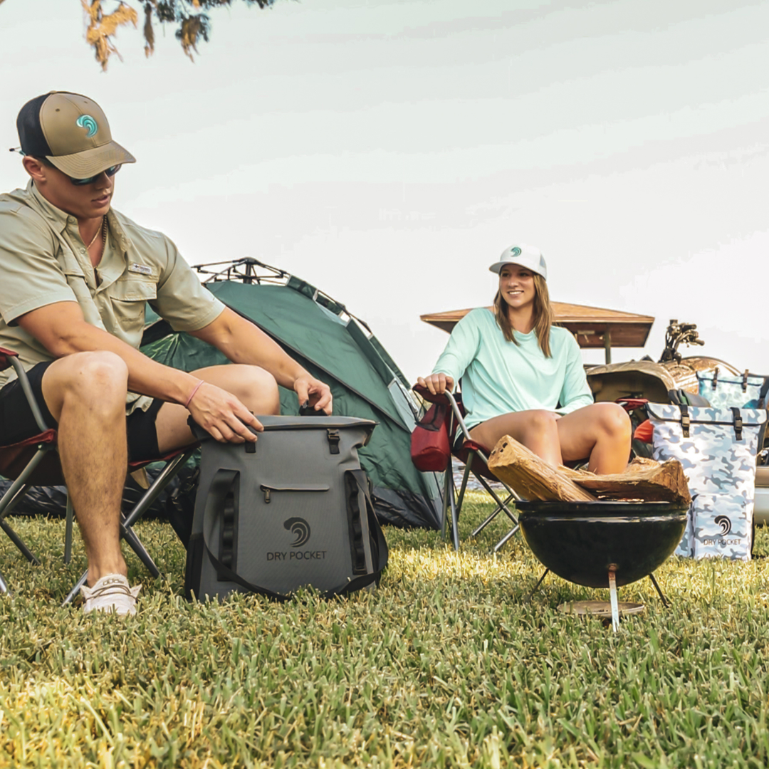 Dry Pocket grey magnetic auto-sealing, waterproof, scent proof, and floating 16 can tote cooler that can also act as a dry bag. 