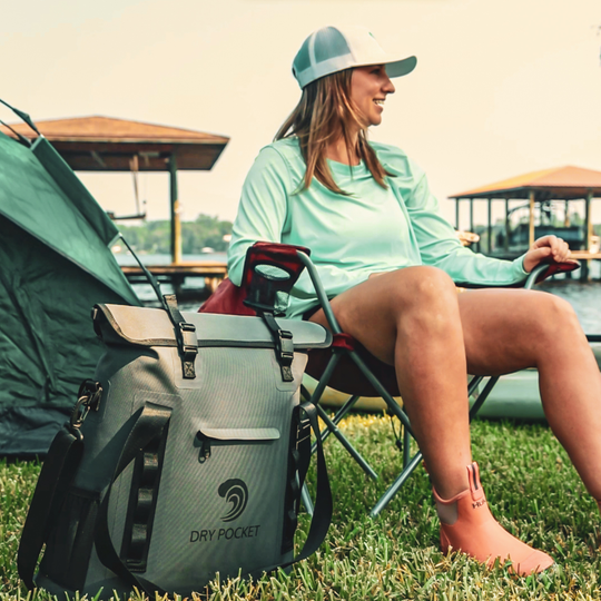 Dry Pocket grey magnetic auto-sealing, waterproof, scent proof, and floating 16 can tote cooler that can also act as a dry bag. 