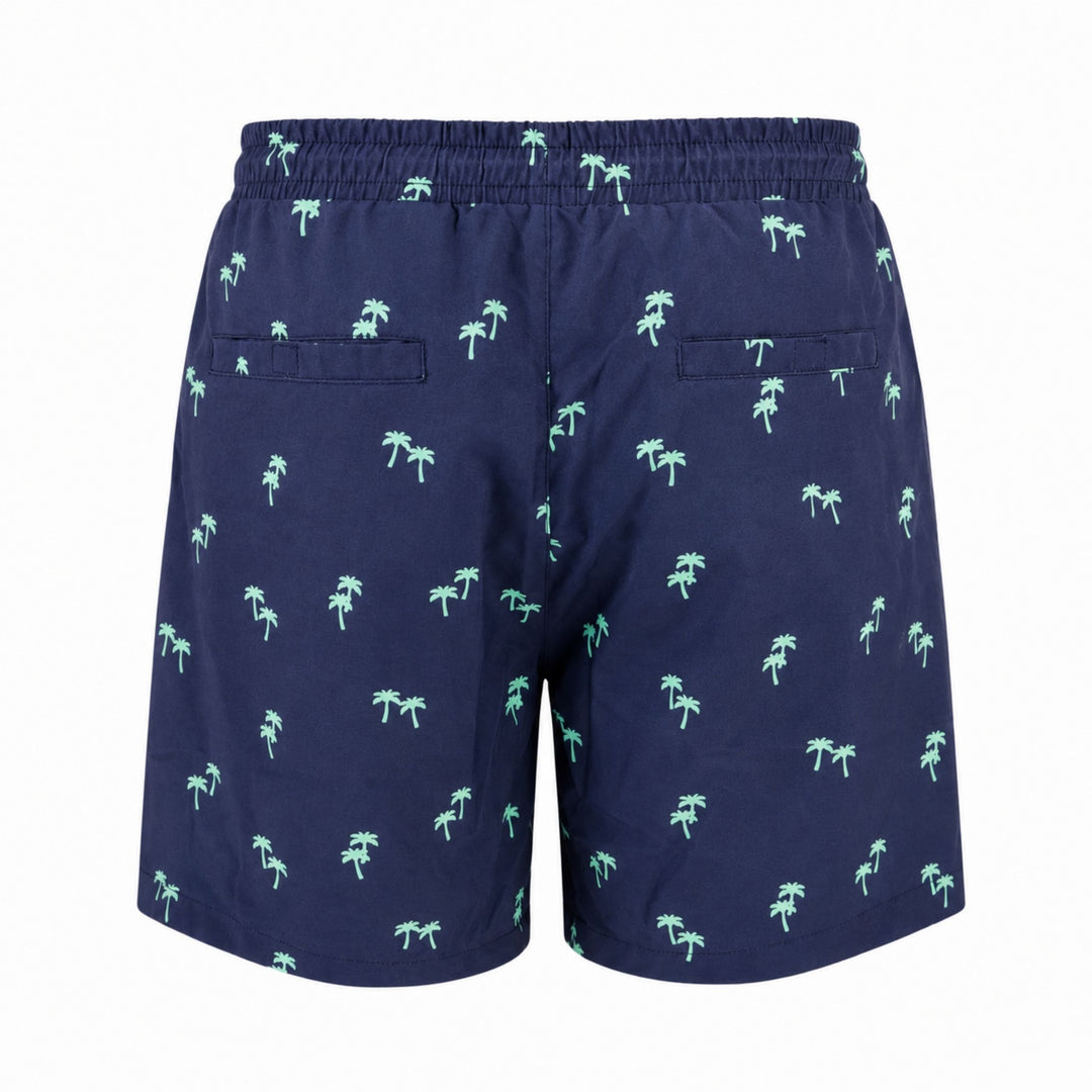 Dry Pocket waterproof swim trunks with palm trees.