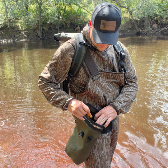 Dry Pocket magnetic double lock auto-sealing, waterproof, scent proof, and floating shell bag or dry bag. 
