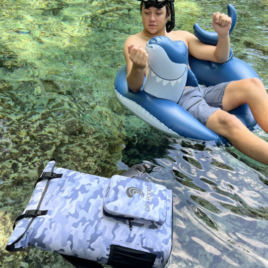 Dry Pocket snow camo magnetic auto-sealing, waterproof, scent proof, and floating backpack cooler that can also act as a waterproof dry bag. 