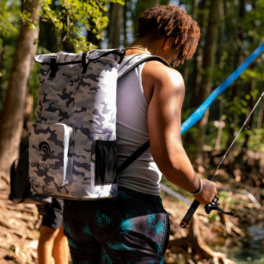 Dry Pocket snow camo magnetic auto-sealing, waterproof, scent proof, and floating backpack cooler that can also act as a waterproof dry bag. 