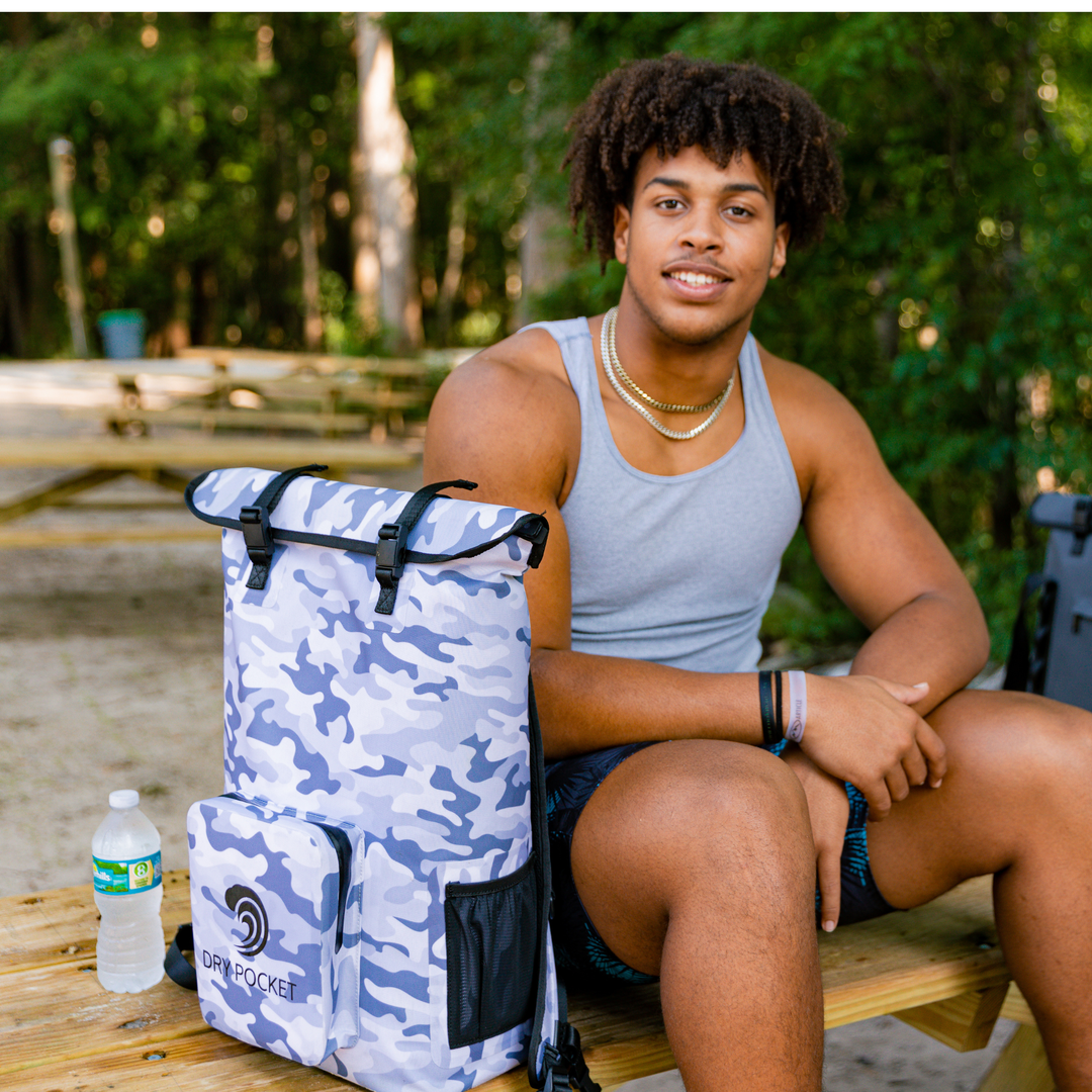 Dry Pocket snow camo magnetic auto-sealing, waterproof, scent proof, and floating backpack cooler that can also act as a waterproof dry bag. 